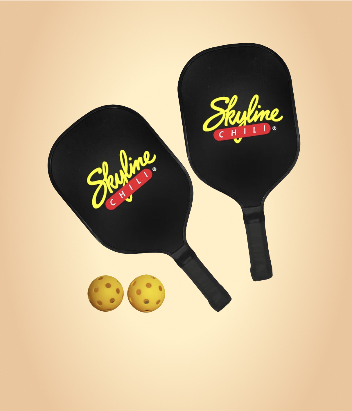 Pickleball paddles and two yellow balls