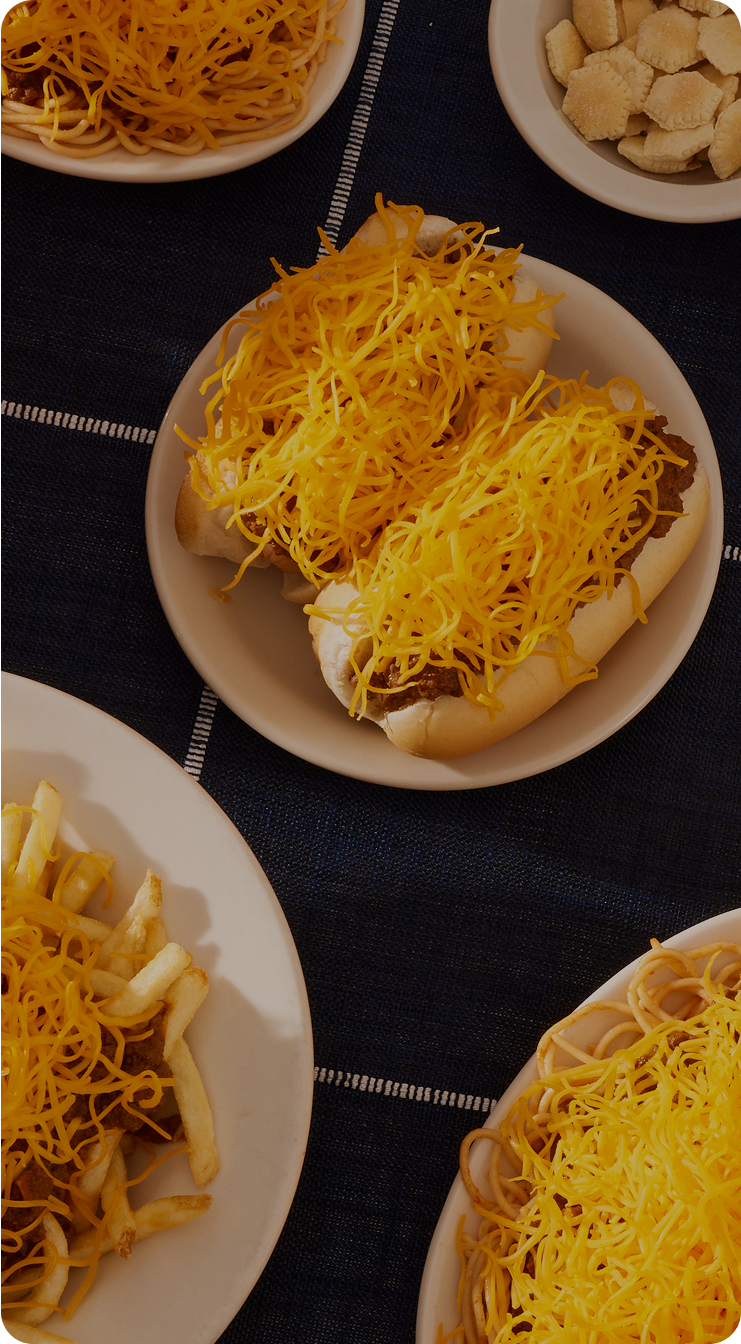 Top down view of table with navy table cloth and various skyline dishes on the table